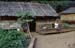 Padong woman longnecked in front of house 8610212