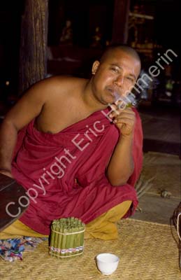 Buddhist monk with cigar 867501