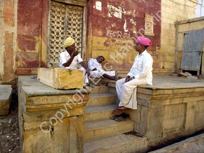 Men sitting talking on stairs Jaisalmer 863236