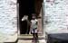 Boy and cow in doorway Jaisalmer 8510326