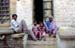 Family in doorway Jaisalmer 857613