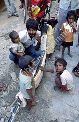 Family on sidewalk Jamnagar 861308