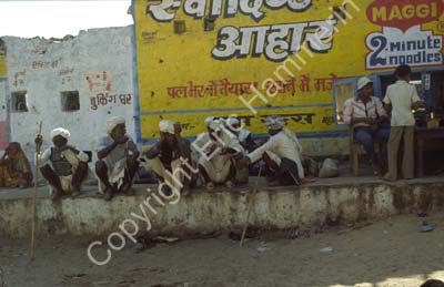 Men with turbans squatting Pushkar 864331