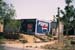 Roadside house with ads Rajasthan 006139
