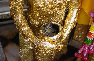 Nakhon Pathom donation cup gold leaf on staue 8725603