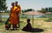 Nakhon Pathom monks and meditation under umbrella 8725530