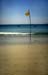 Flag pole on the beach 8721427
