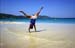 Girl cartwheeling on the beach 8721415