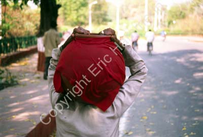 Man carrying jars 002314
