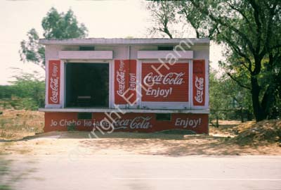 Roadside house with ads Rajasthan 006141