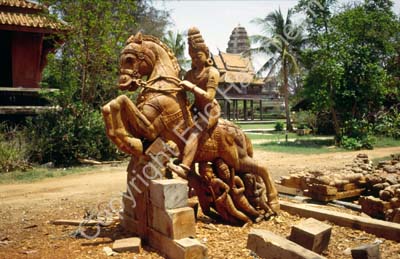 Wooden statue being carved 8724813